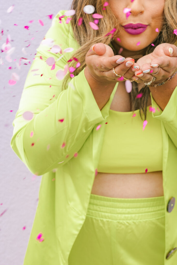 Editorial portrait of a playful rebrand business session in Greenville, SC. Featuring bold makeup, nail art, and vibrant confetti—perfect for showing off a bold, visually joyful personality.