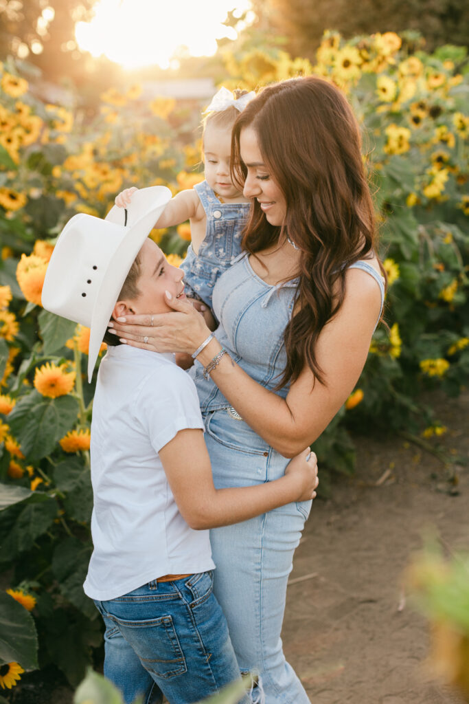 Reimagine your family photos with golden hour portraits in a sunflower field.