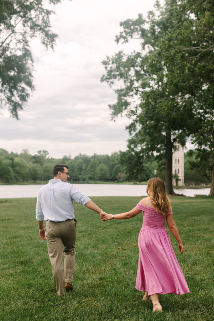 Couple walking past a brick building with trailing ivy in downtown Greenville – Dani Lacey Photographs Furman University