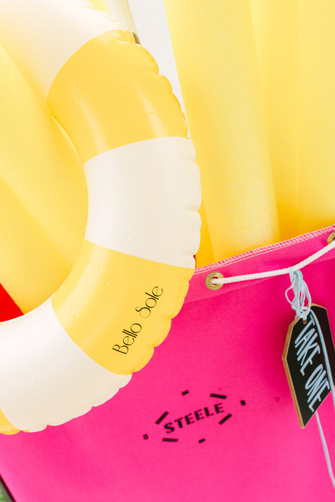 Bello Sole inflatable float with pool noodles in a hot pink bin — fun pool party style inspiration details by Dani Lacey Photographs.