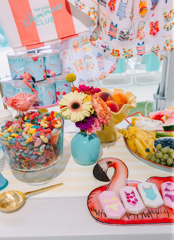 Bright and playful pool party snack table with candy, cookies, and fruit — colorful pool party style inspiration by Dani Lacey Photographs.