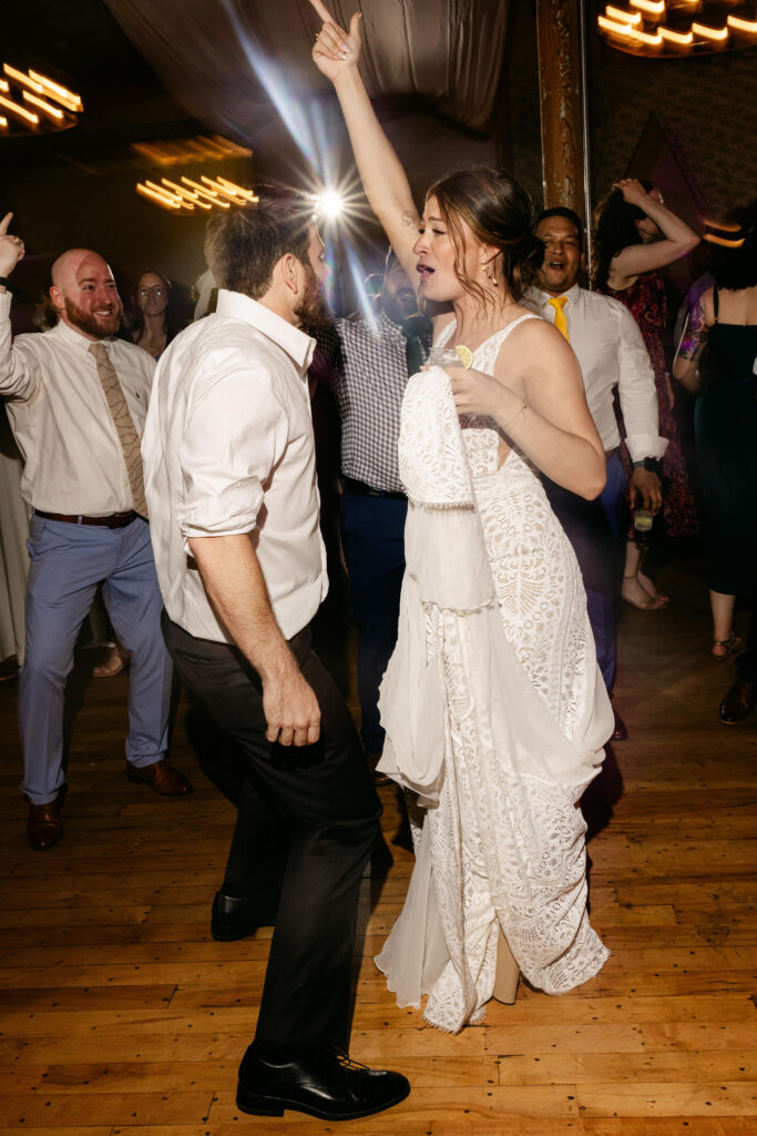 Bride and groom dancing together at their Greenville wedding reception at Judson Mill – Dani Lacey Photographs