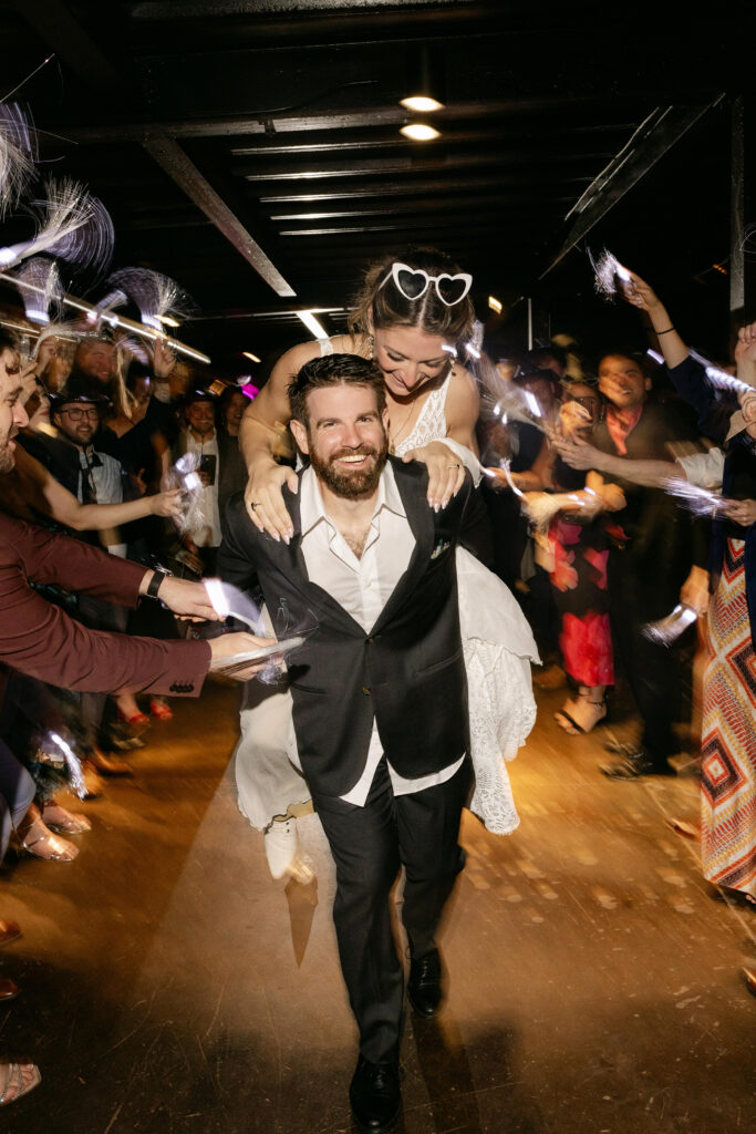 Bride and groom exit their wedding at Judson Mill wedding reception in Greenville SC – Dani Lacey Photographs