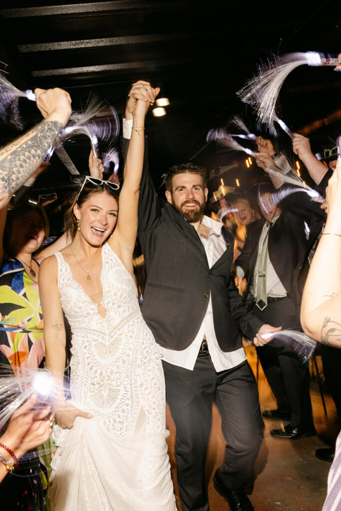 Bride and groom exit their wedding at Judson Mill wedding reception in Greenville SC – Dani Lacey Photographs