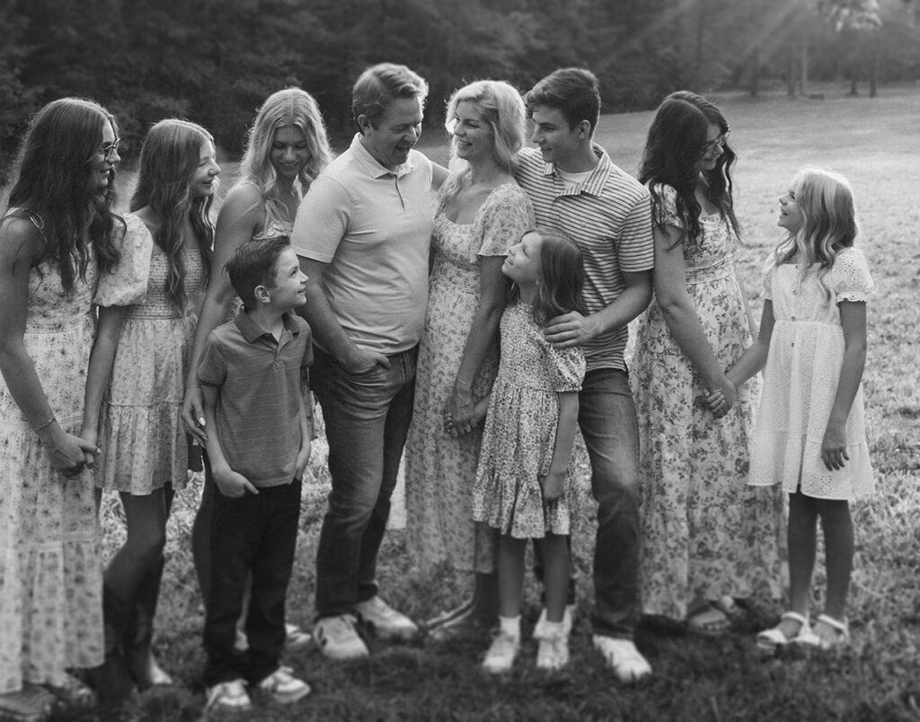 Black and white family portrait during an at-home photo session.