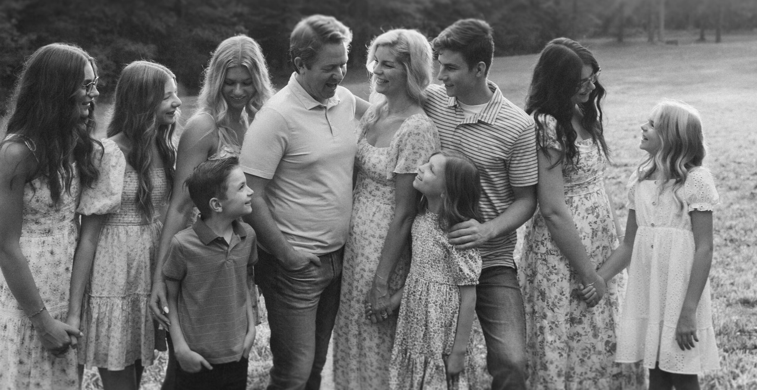 Black and white family portrait during an at-home photo session in Greenville SC. Dani Lacey Photographs