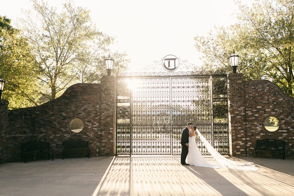 Bride and groom at iron gates