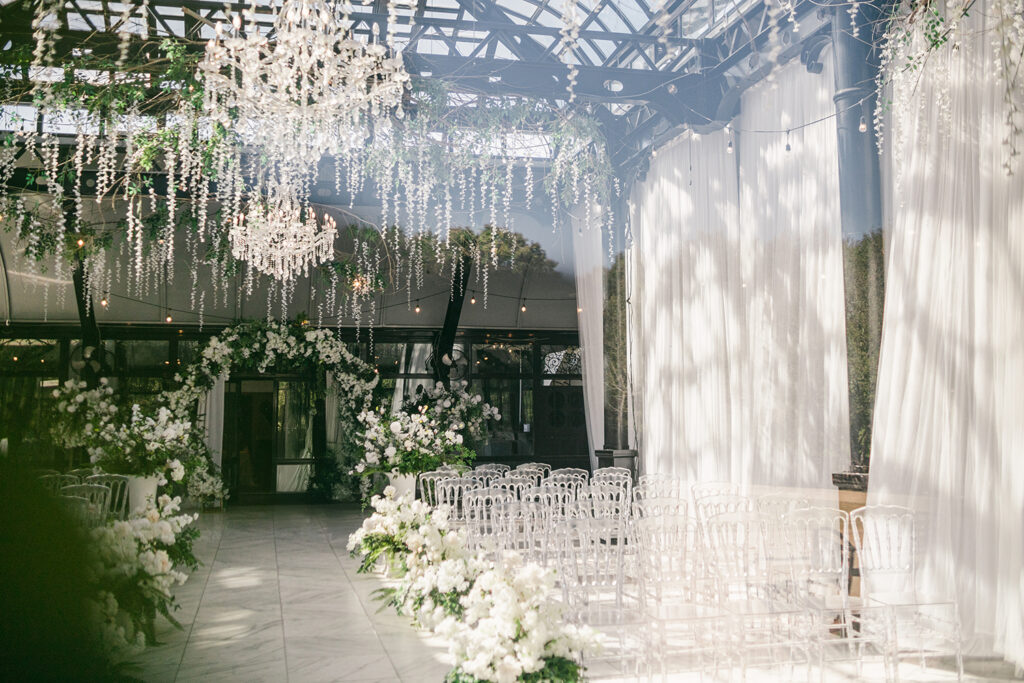 Ceremony setup inside glass conservatory