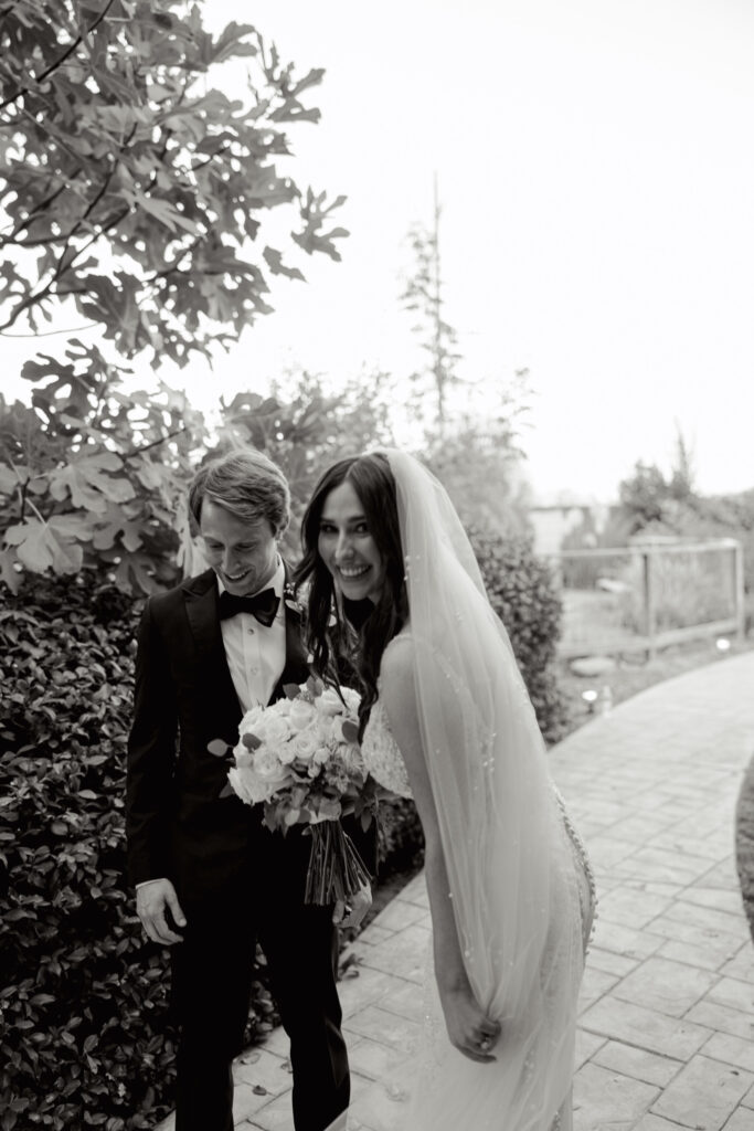 Bride and groom walking together outdoors after their ceremony in South Carolina.