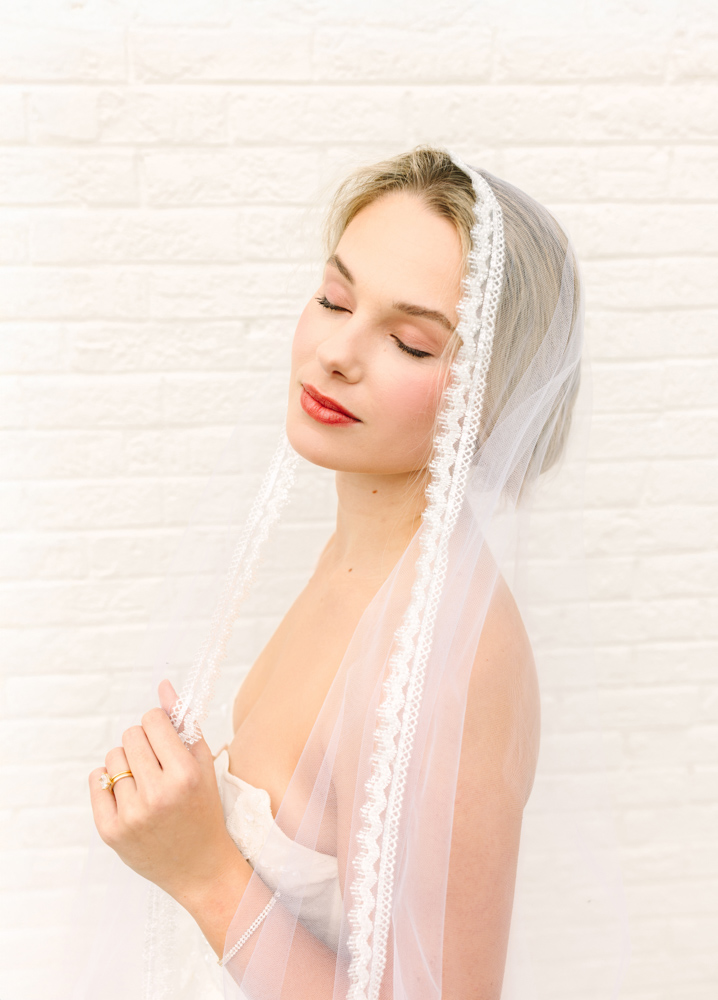Bride with handmade lace veil church bridals