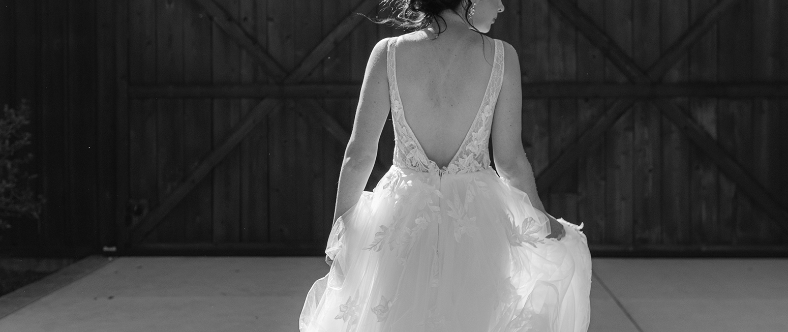 Bride walking indoors with long veil