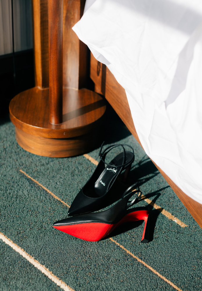 Black wedding heels on bridal veil