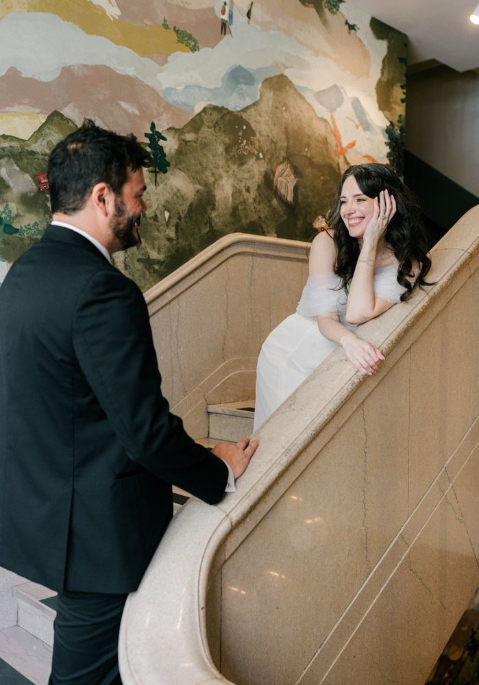 Couple laughing on courthouse staircase