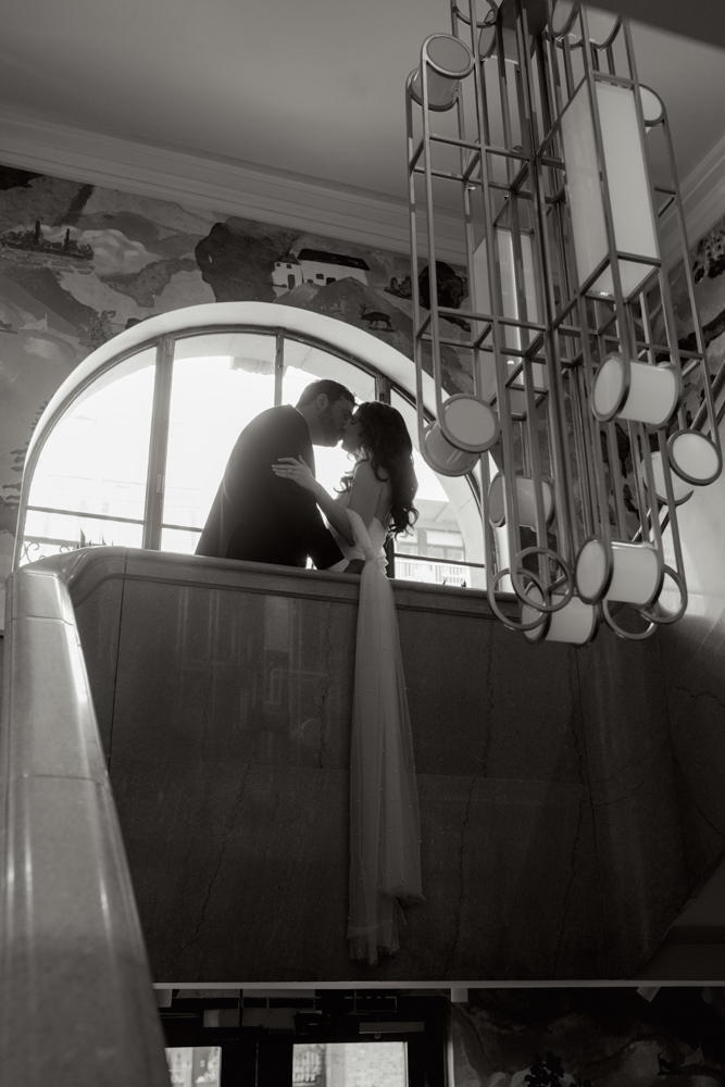 Couple kissing on courthouse staircase