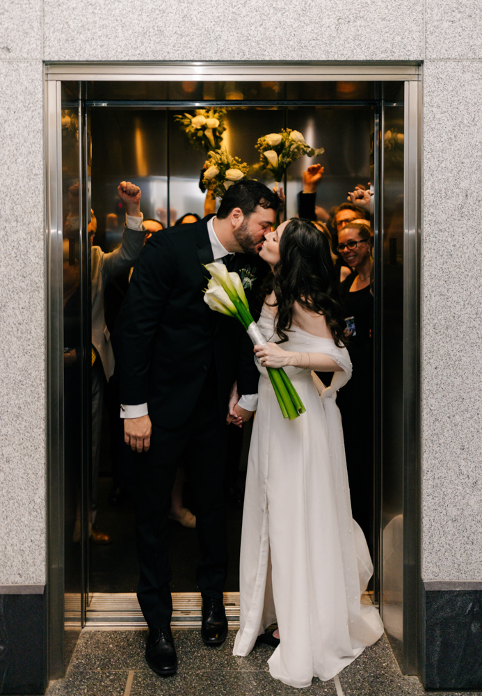 Couple kissing in courthouse elevator at Downtown Asheville Courthouse Wedding 