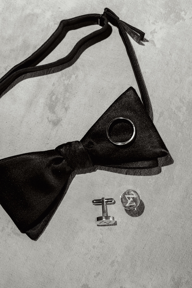 Groom wedding details with cufflinks and bowtie