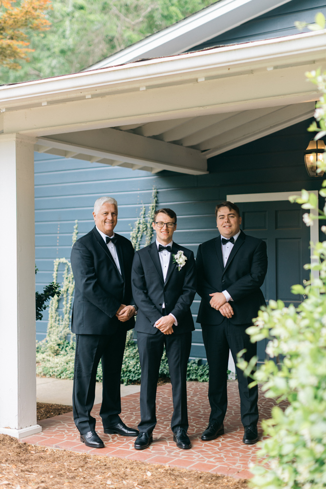 Groom portrait with family members
