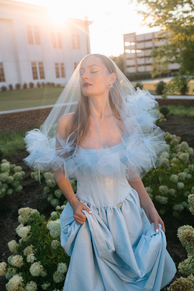 Bride wearing blue gown and sheer veil