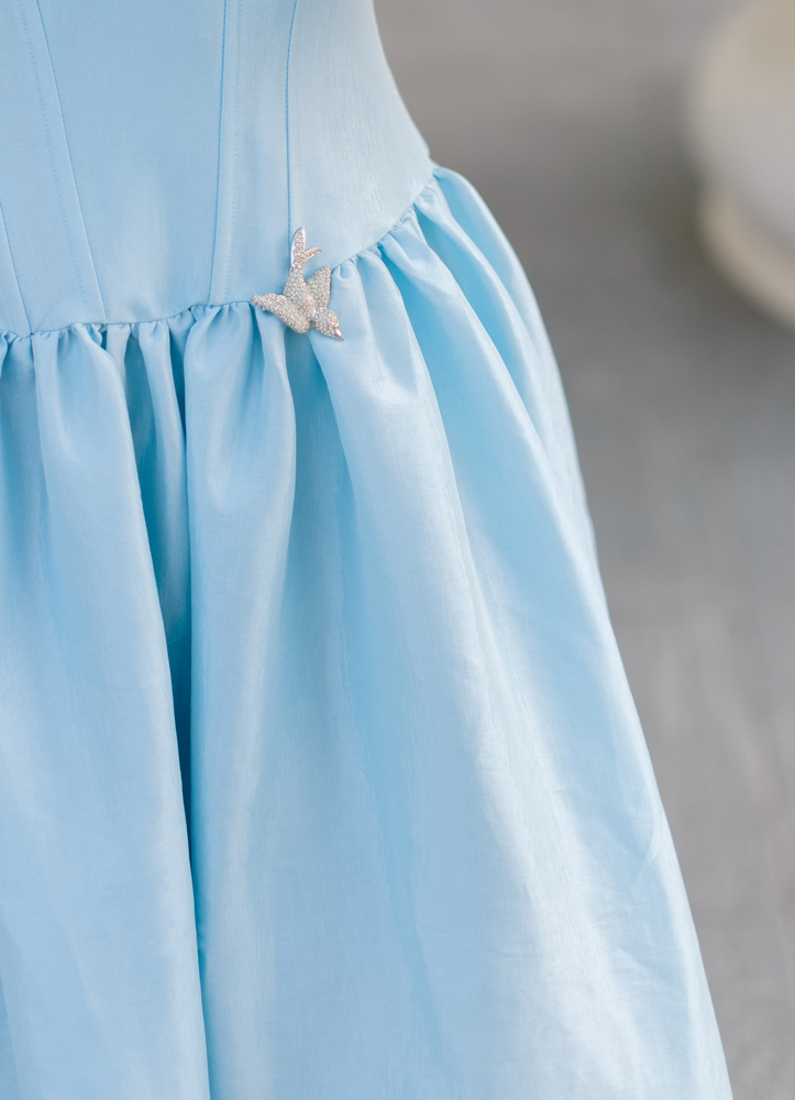 Bird detail on blue wedding dress