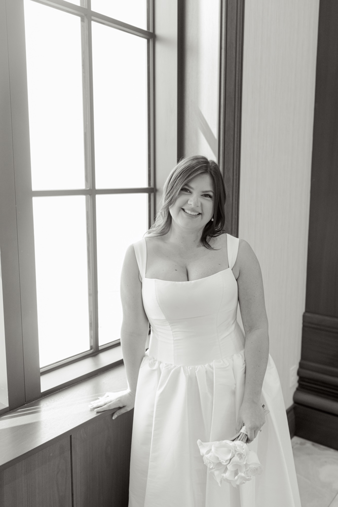 Bride portrait by courthouse window in Spartanburg