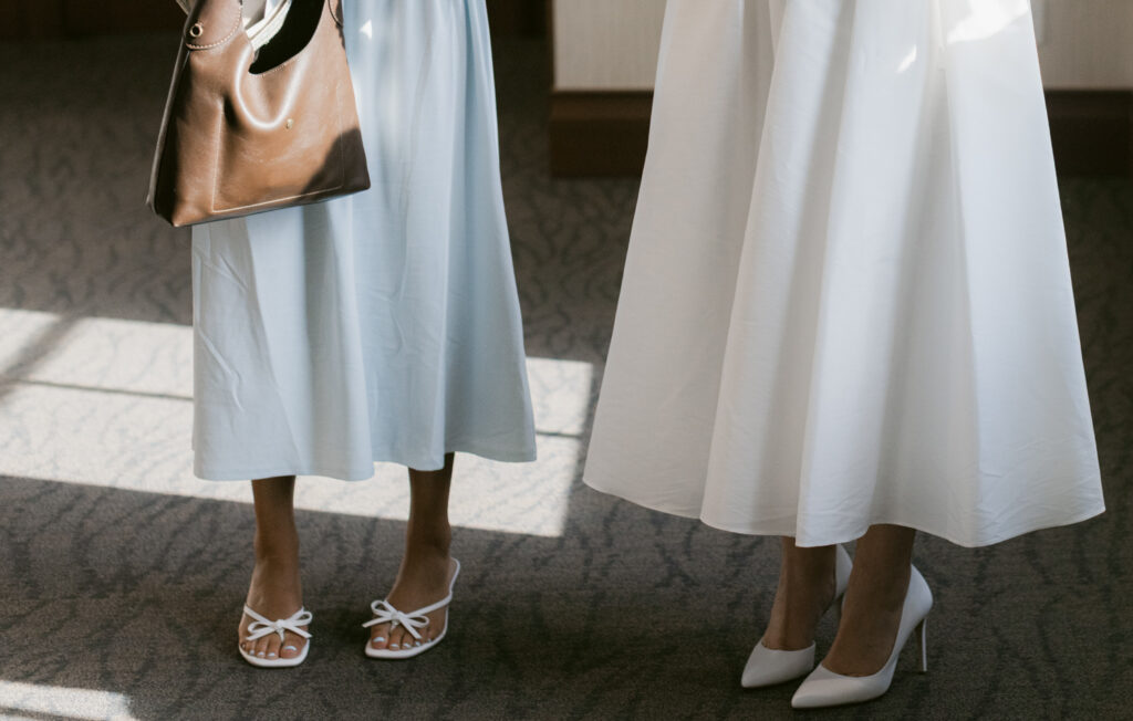 Bride and guest wedding shoes before courthouse ceremony