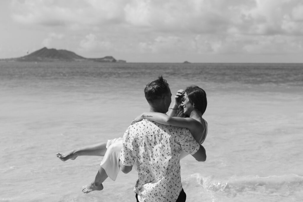 Black and white portrait of couple on Oahu beach