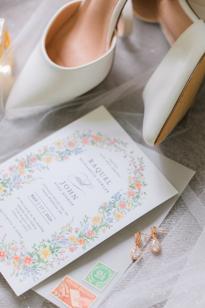 Wedding invitation with bridal shoes and earrings