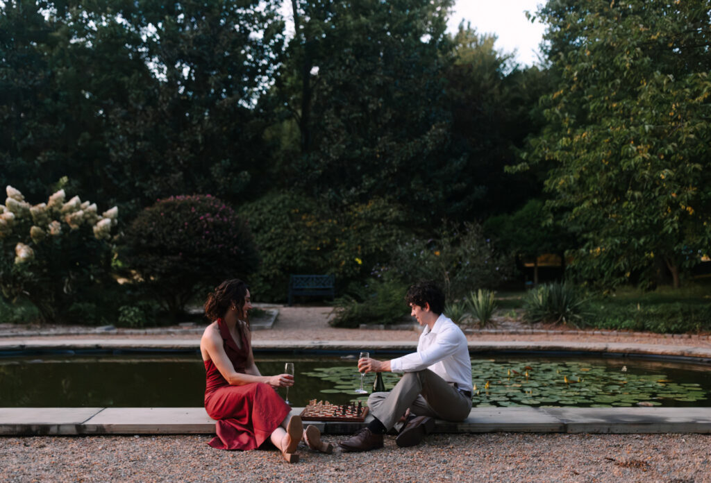 Wide portrait of couple playing chess at Furman University.