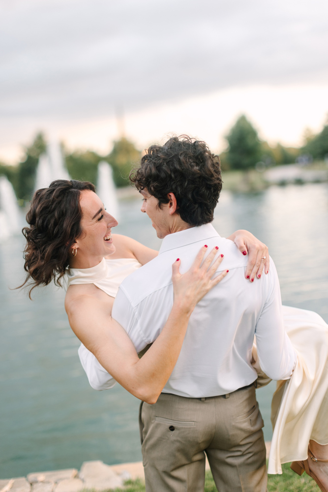 Couple laughing beside Furman University fountains