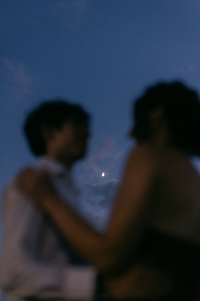Moon portrait through couple at Furman University.